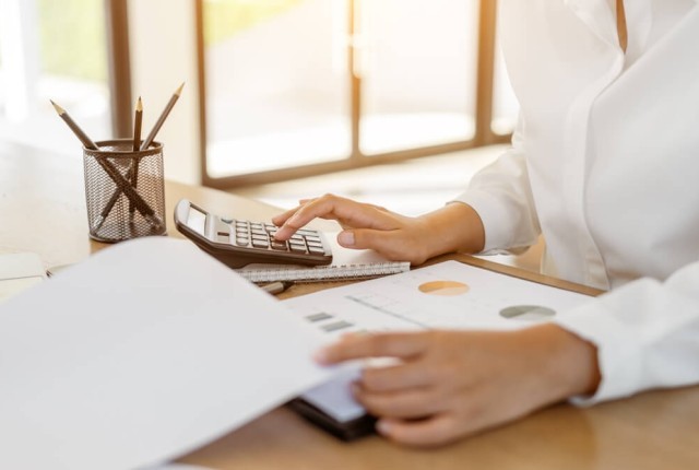 Businesswoman checking finances